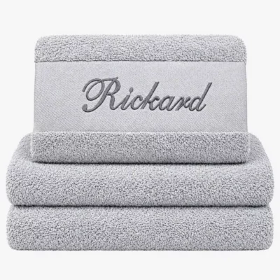 Gray towel with name and black text