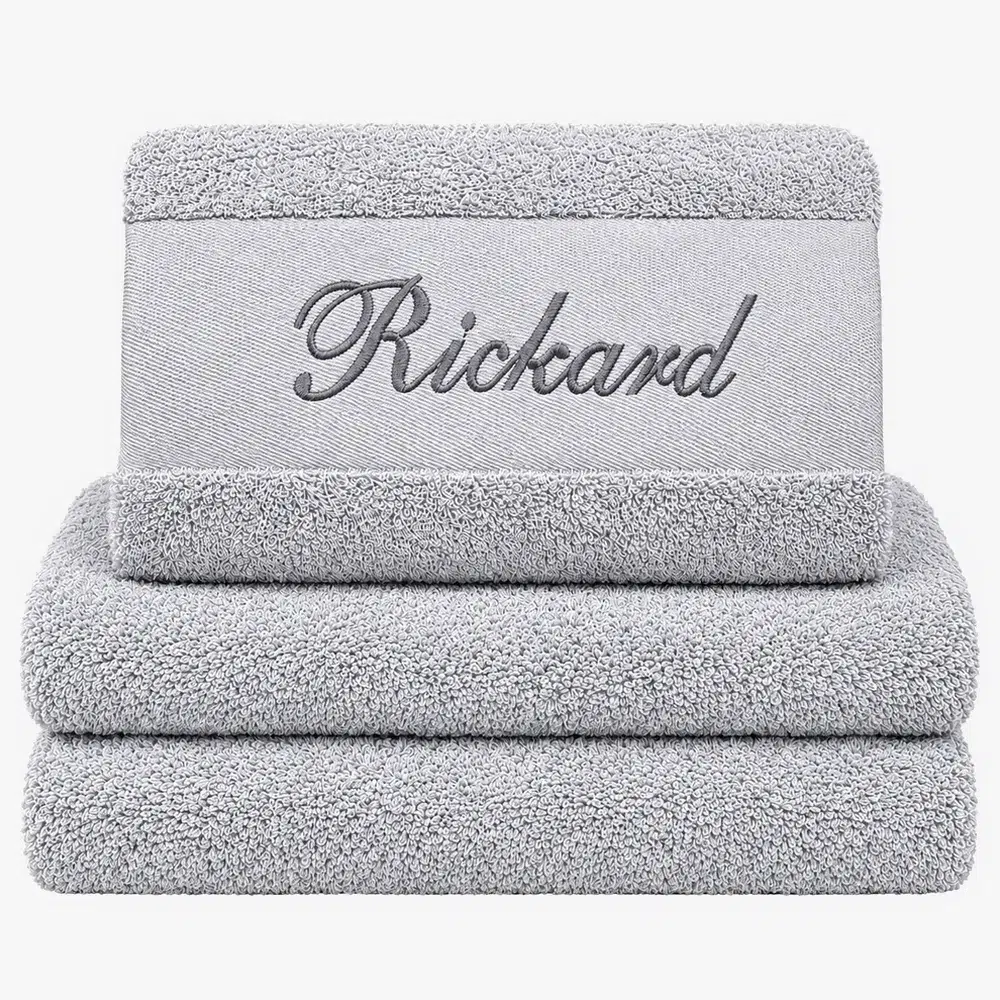 Gray towel with name and black text